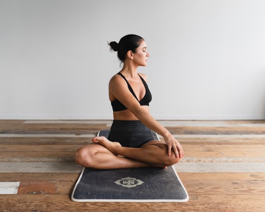 Woman stretching at home in the morning
